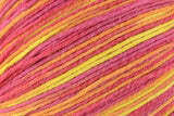 Close-up of a multicolor yarn or thread bundle with strands of pink, orange, yellow, and red interwoven.