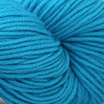 Close-up of blue yarn on a white background