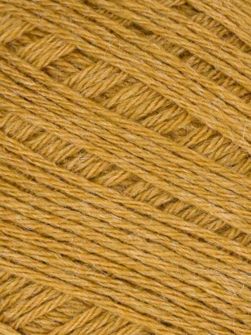 A close-up texture shot of mustard yellow yarn wound diagonally in a herringbone pattern.