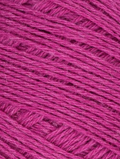 A close-up of bright magenta pink yarn strands wound together, showing the texture and color of the fiber.