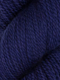 A close-up of dark navy blue yarn showing its soft, twisted texture.