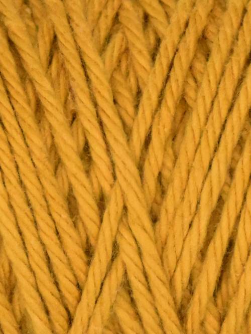 Close-up of yellow yarn with a textured pattern
