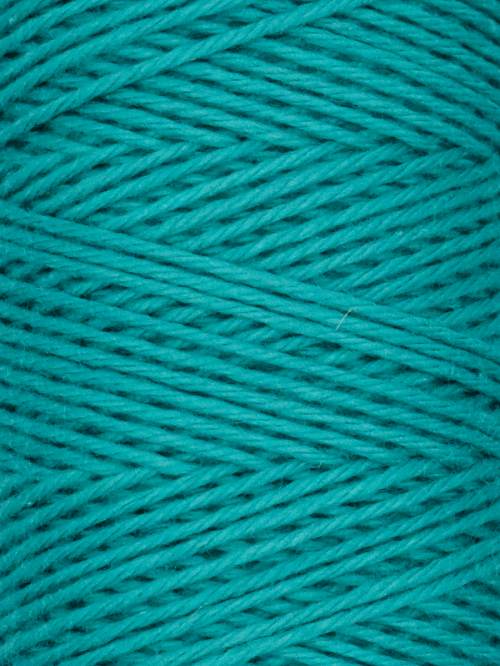 Close-up of teal yarn with visible texture