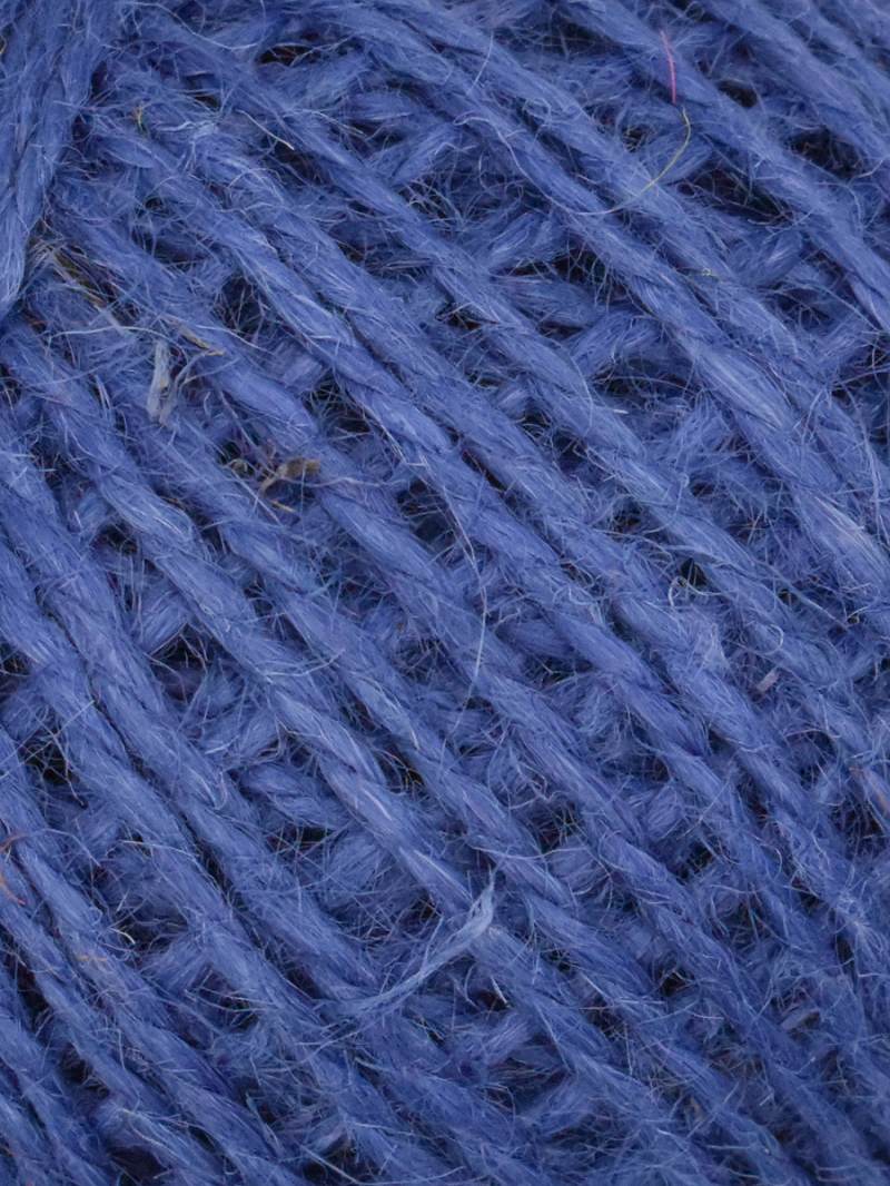 A close-up of textured yarn in a dusty medium blue-purple color, filling the entire frame.