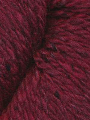 A close-up of dark burgundy wool yarn with subtle black flecks, showing the soft texture and twisted plies of the fiber.