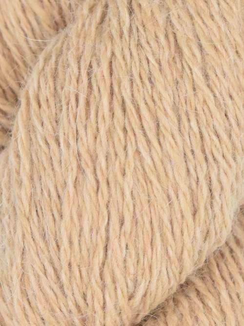 Close-up of beige yarn with visible texture