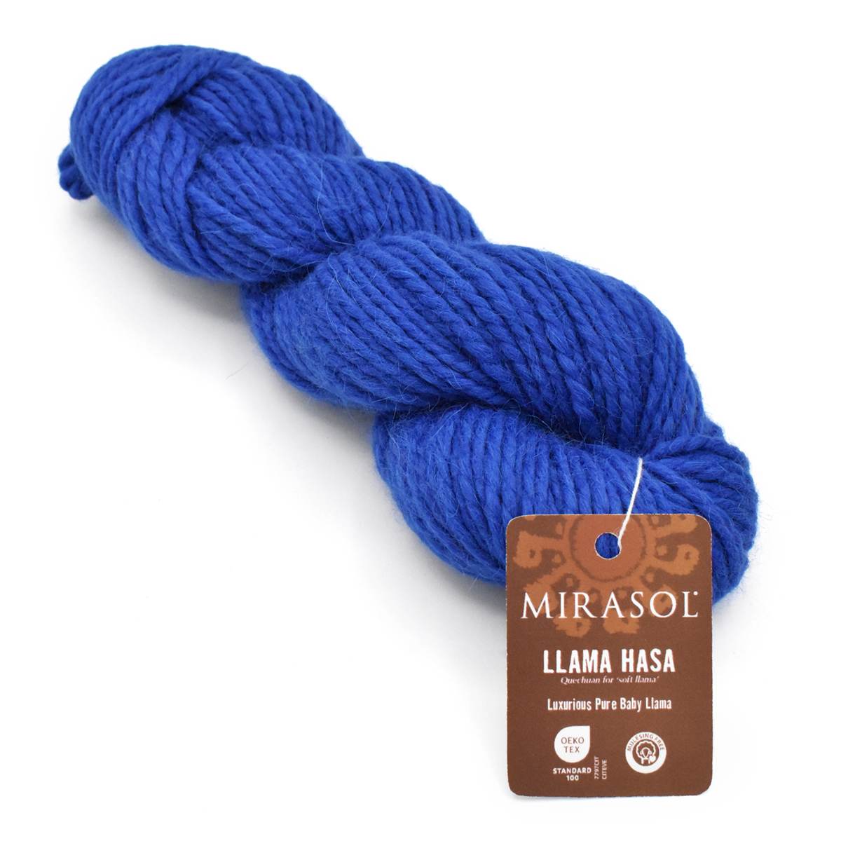 A skein of Mirasol Llama Hasa luxury pure ruby llama wool yarn in a rich royal blue color, with its brown paper brand tag attached, on a clean white background.