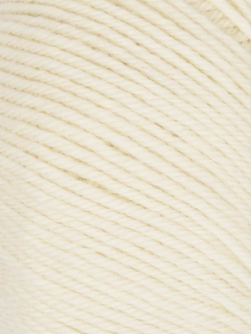 A close-up of cream-colored yarn with a twisted plied texture filling the frame.