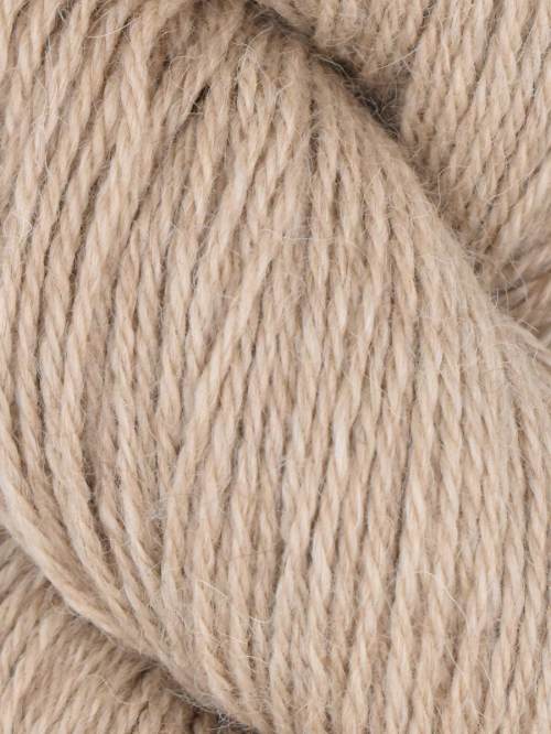 Close-up of beige yarn with visible texture