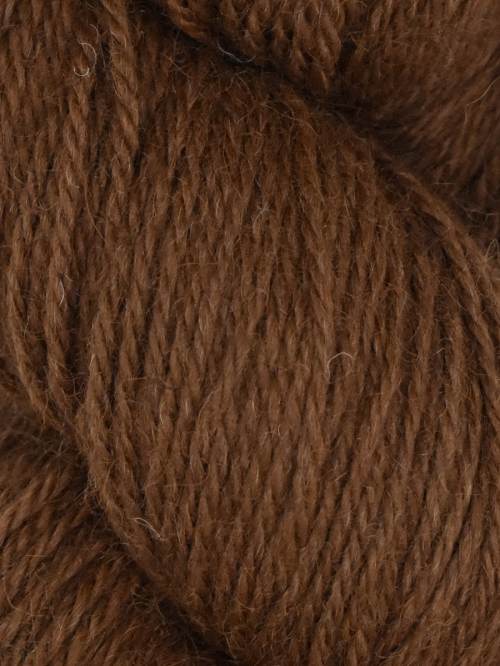 A close-up of a brown skein of yarn, showing the twisted plies and fuzzy texture of the wool.