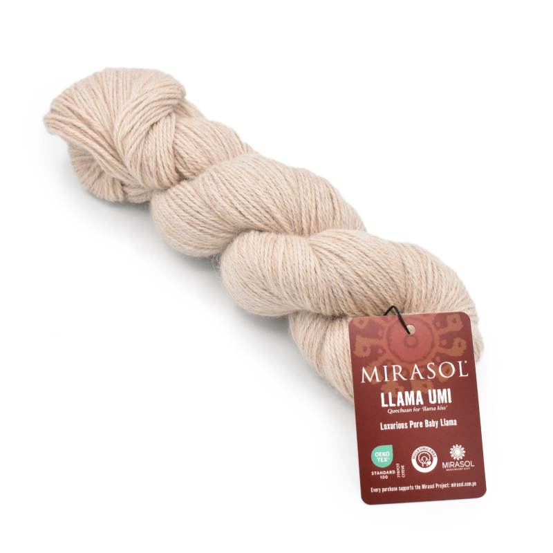Beige skein of yarn with a Mirasol label on a white background