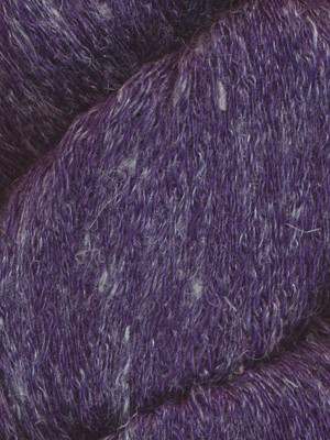 A close-up of a textured purple yarn with subtle white and violet flecks throughout.