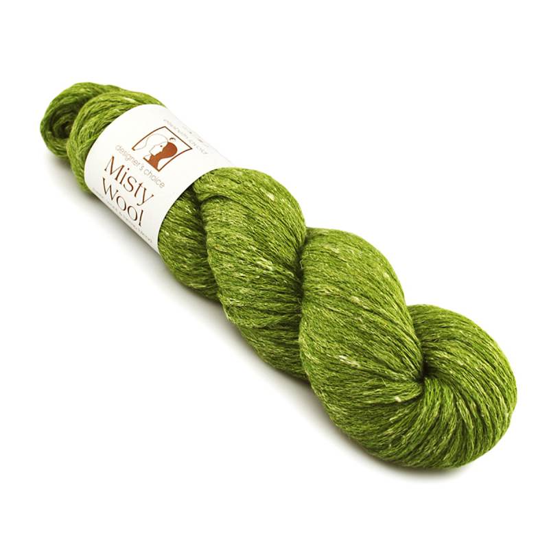 A skein of Misty Wool yarn in a heathered olive green color, featuring a white paper label with the brand name and logo, set against a plain white background.