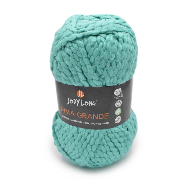 A skein of Jody Long Pima Grande yarn in a vibrant mint green color, wrapped with its black paper label, on a clean white background.