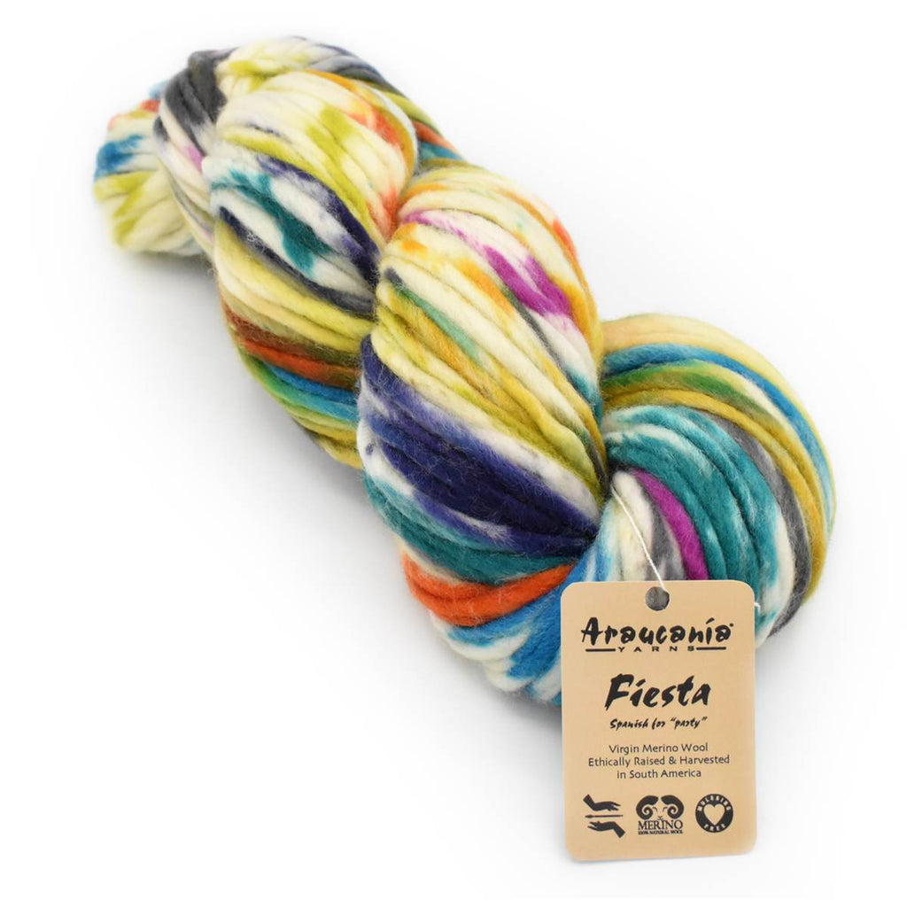 A skein of multicolor variegated yarn with a tan paper hangtag reading 'Artesano Pablo Fiesta' on a clean white background.