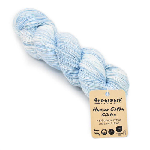 Light blue yarn skein with a label on a white background
