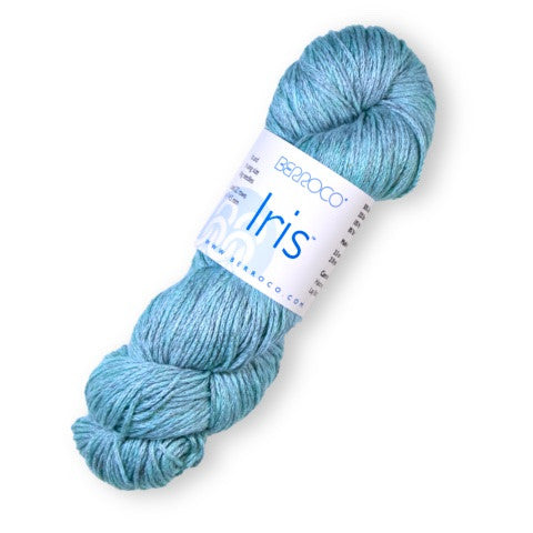 A skein of light blue yarn with a white paper label reading 'Bianco' and 'Iris' on a plain white background.