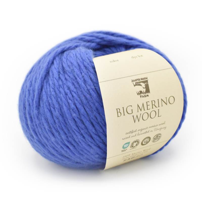 Blue ball of Big Merino Wool yarn with a label on a white background
