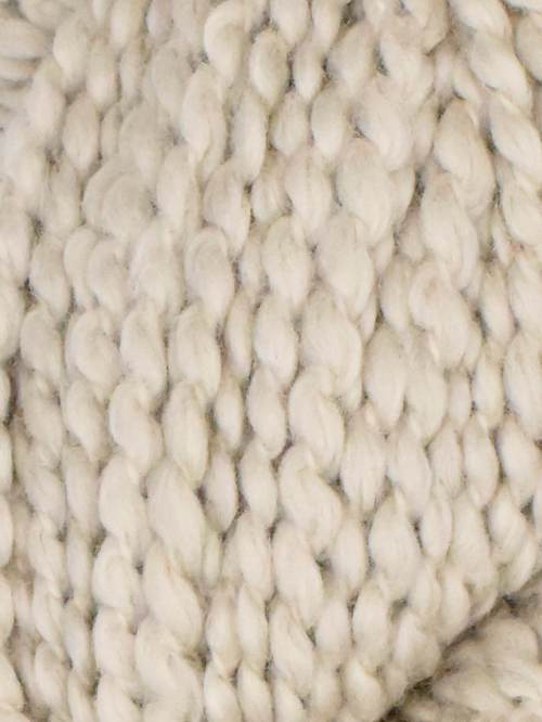 Close-up of a textured white fabric surface