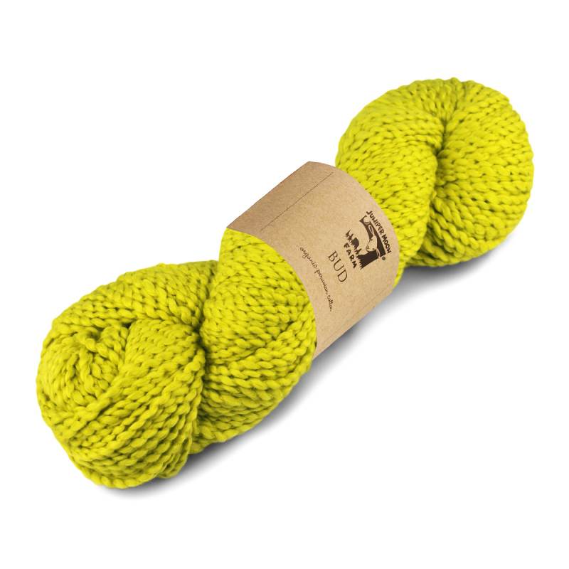 Two skeins of bright yellow yarn with a brown label on a white background