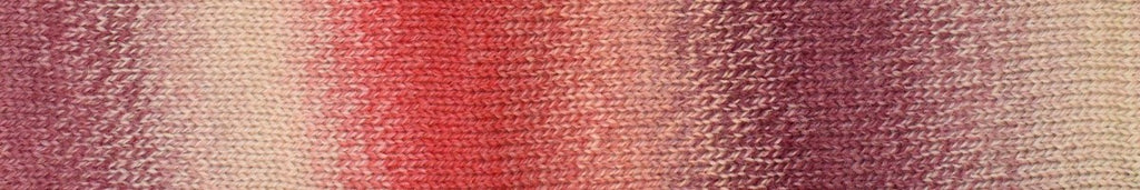 A close-up of a textured knit fabric swatch featuring a vertical gradient pattern transitioning from dusty rose pink to coral red and light beige.