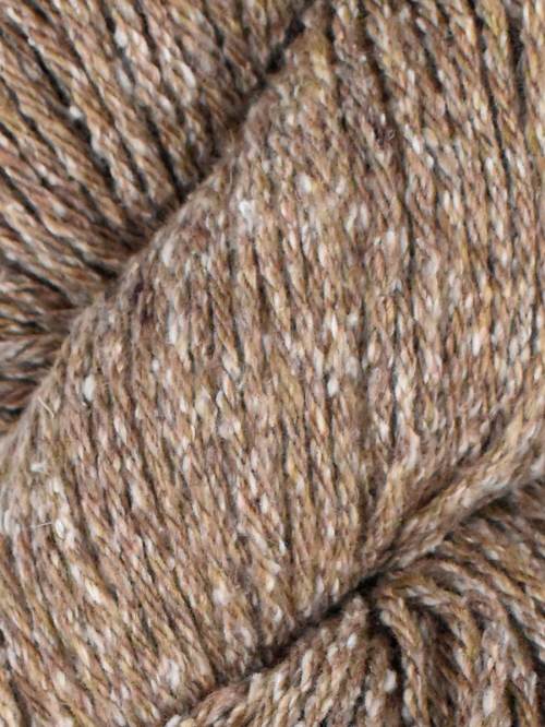 Close-up of brown yarn with speckles
