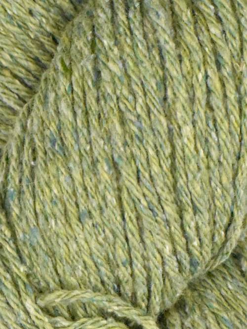 Close-up of green yarn with speckles