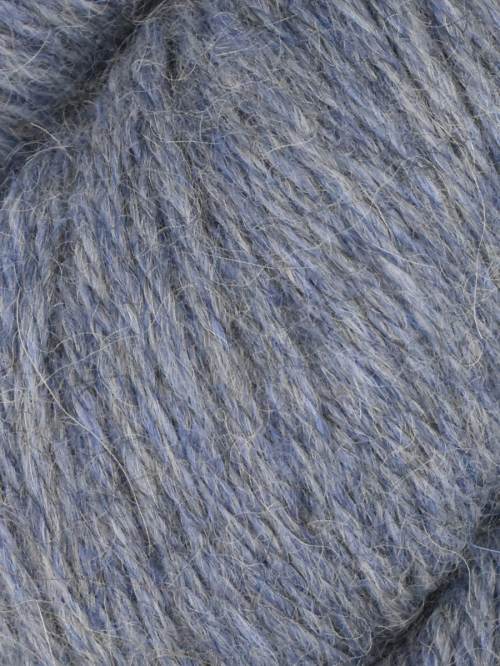 A close-up of soft, fuzzy yarn in a heathered dusty blue-gray color, showing the textured strands and fibers.