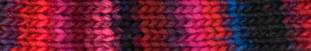 Close-up of a knitted fabric with red, black, and blue pattern