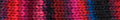 Close-up of a knitted fabric with red, black, and blue pattern