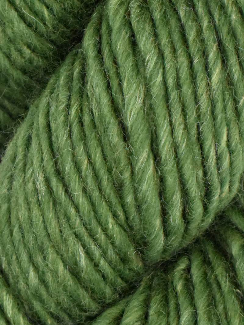 Close-up of green yarn with a textured surface