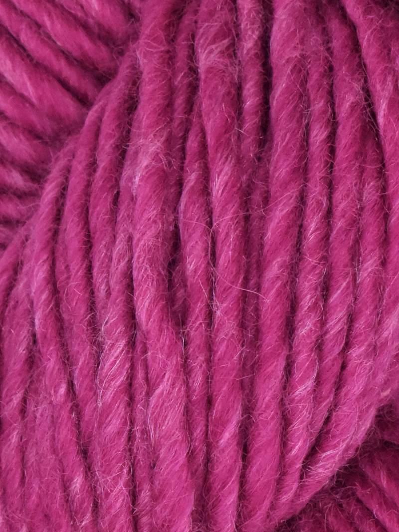 Close-up of pink yarn with a textured surface
