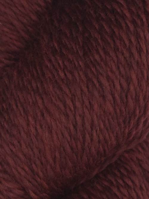 Close-up of a ball of dark red yarn