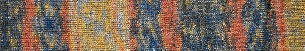 A close-up of a woven textile or rug pattern with vertical stripes in blue, orange, yellow, and gray.
