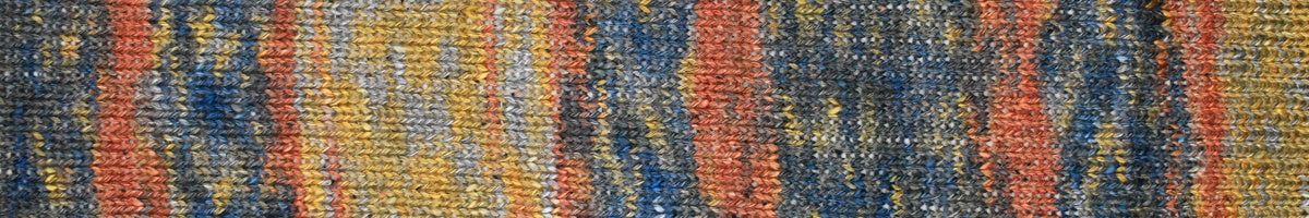 A close-up of a woven textile or rug pattern with vertical stripes in blue, orange, yellow, and gray.