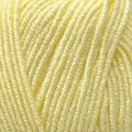 A close-up of pale pastel yellow yarn strands filling the frame.
