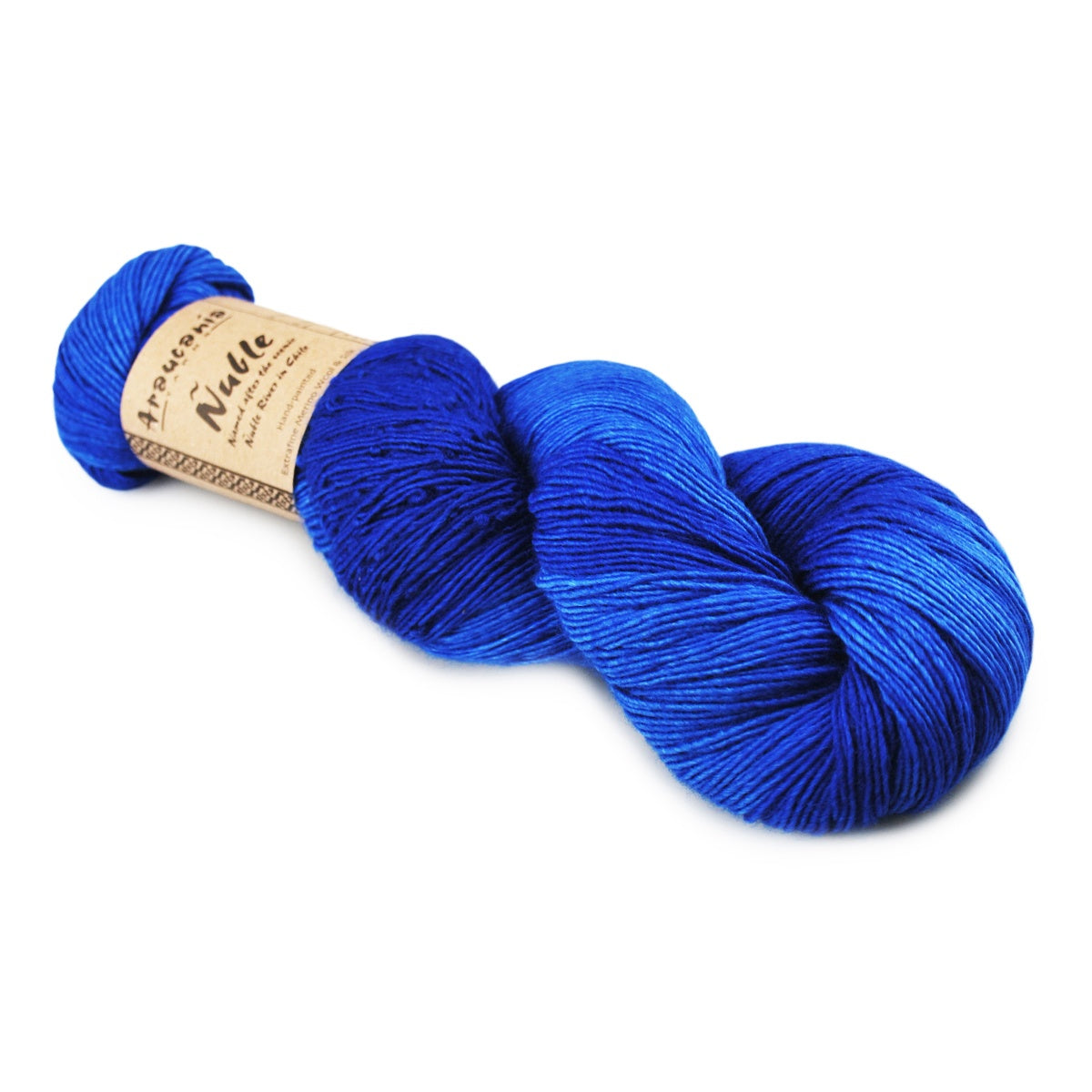 A skein of vibrant royal blue variegated yarn with a tan paper label, photographed on a clean white background.
