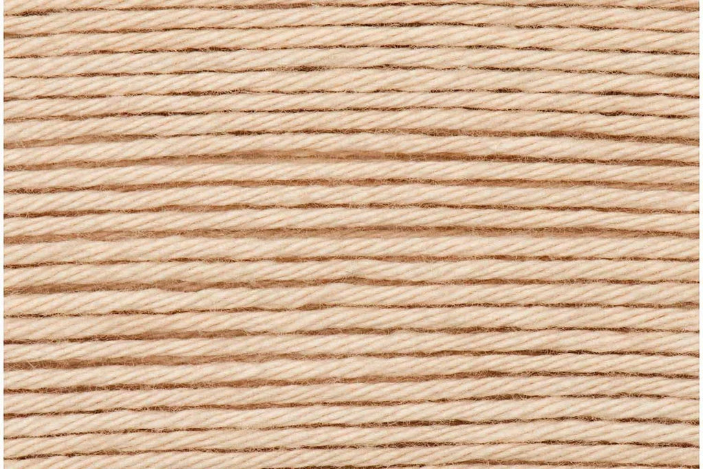 A close-up texture shot of light tan twisted cotton cord or thread, filling the entire frame.