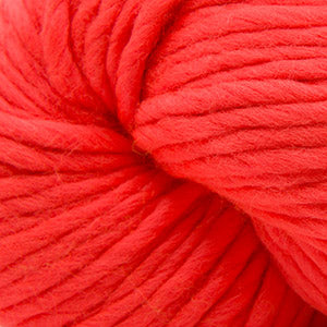 A close-up of bright orange yarn wound into a skein, showing the texture and color of the fiber.