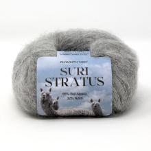 Ball of yarn labeled 'Suri Stratus' on a white background