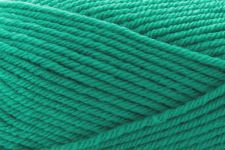 A close-up of bright teal green yarn strands wound together, filling the entire frame.