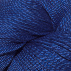 Close-up of blue yarn with a visible brand label.