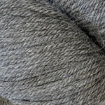 A close-up of gray yarn texture, showing the twisted fibers and heathered color.