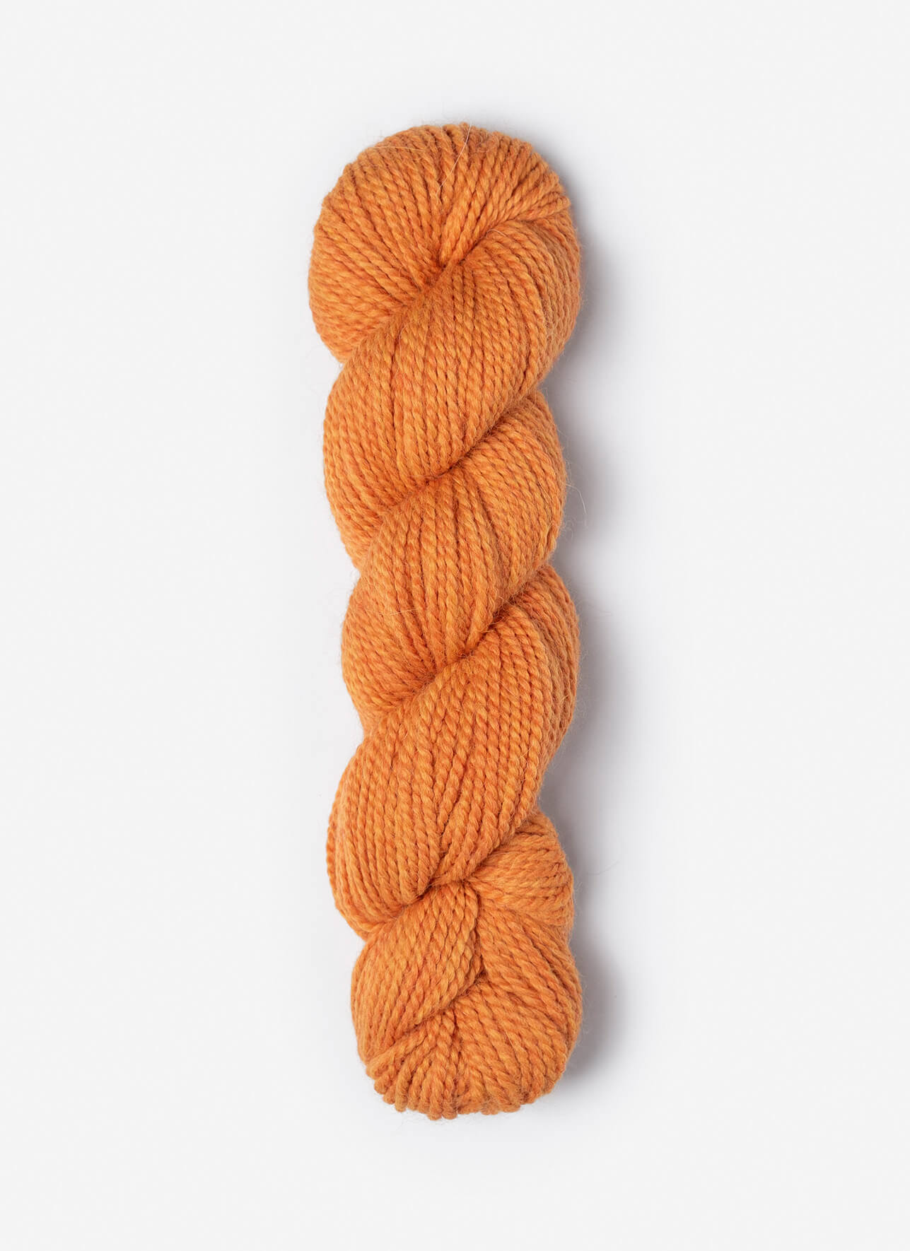 Orange skein of yarn on a white background