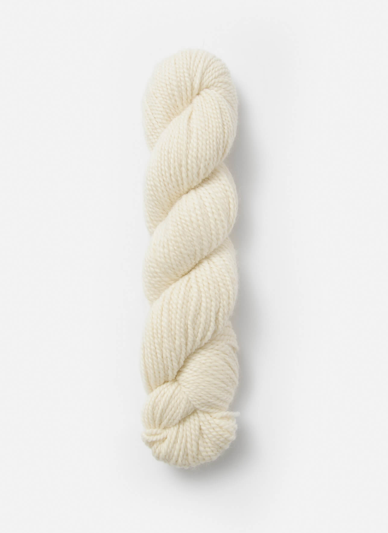 A single skein of cream-colored yarn, twisted into a plied structure, shown vertically against a clean, light gray background.
