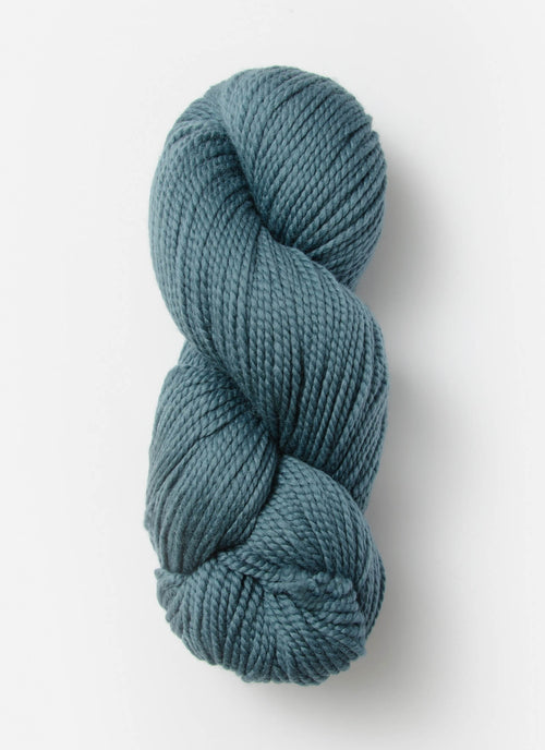 Blue skein of yarn on a white background