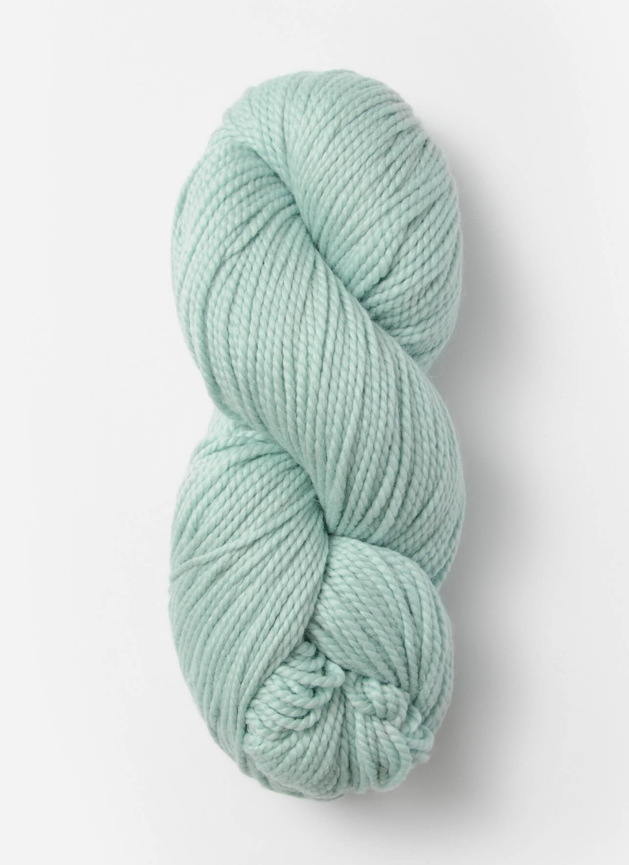 Light green skein of yarn on a white background