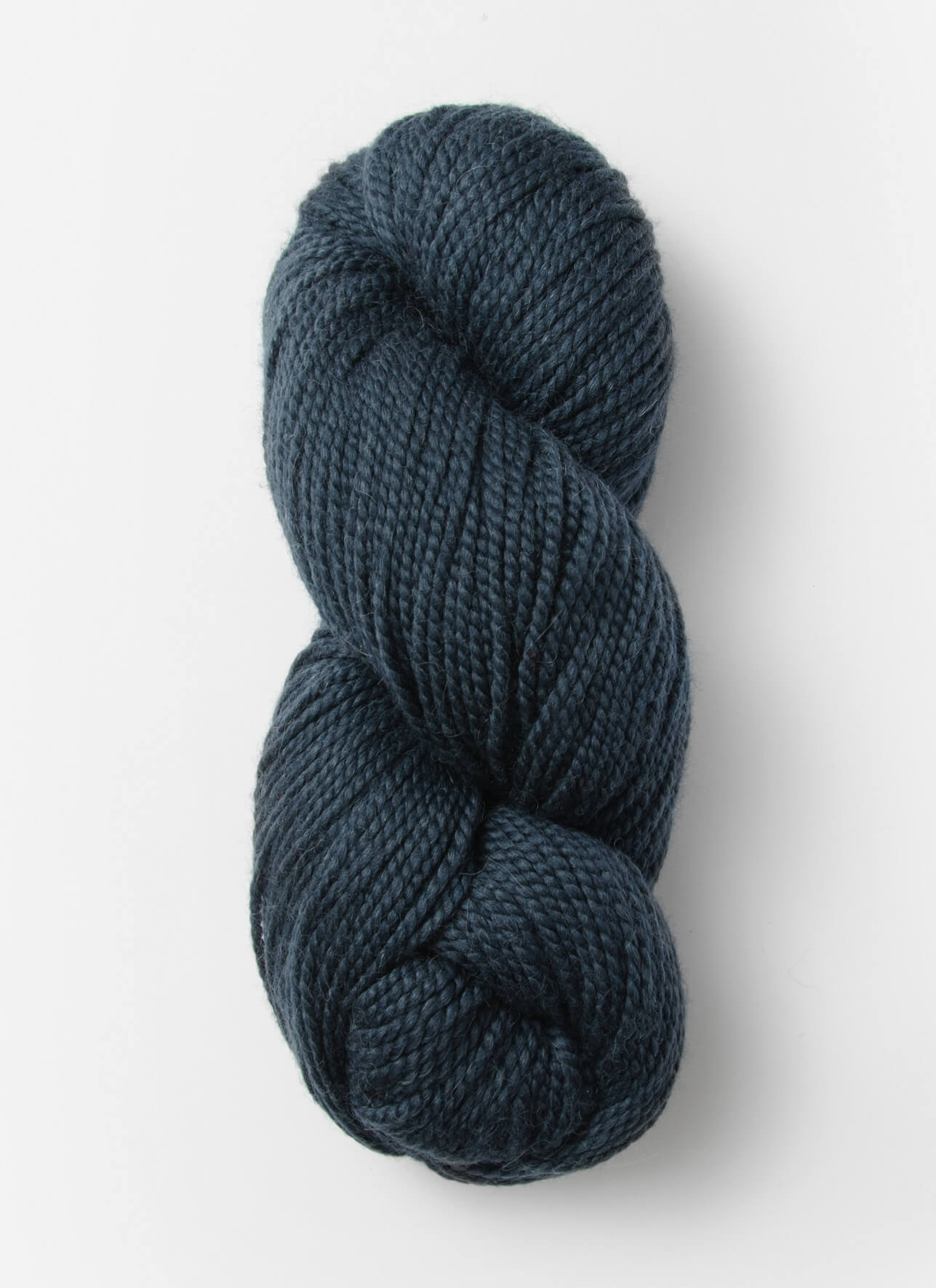 A single skein of dark navy blue yarn, twisted into a classic hank, photographed against a clean white background.