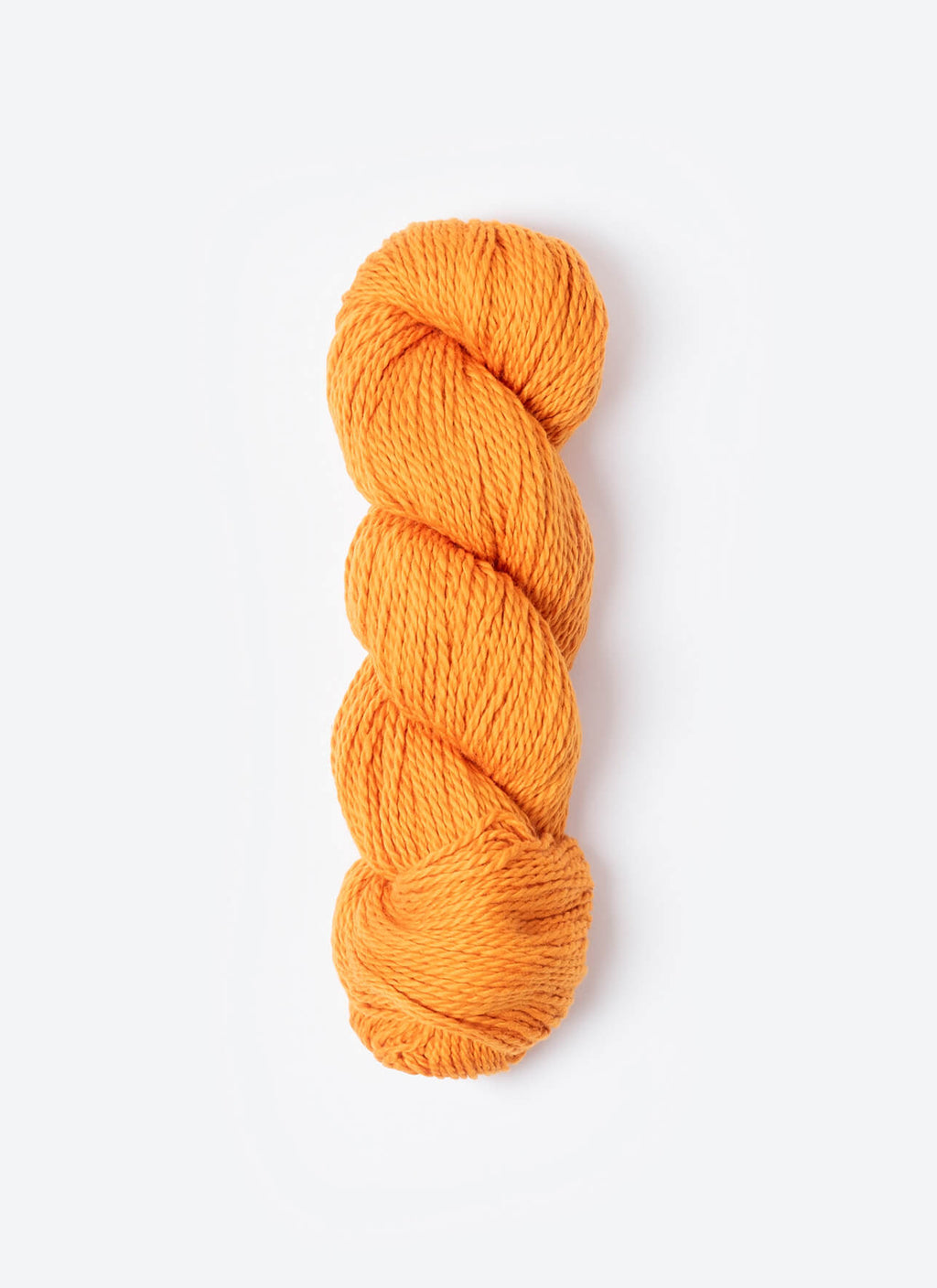 Orange skein of yarn on a white background