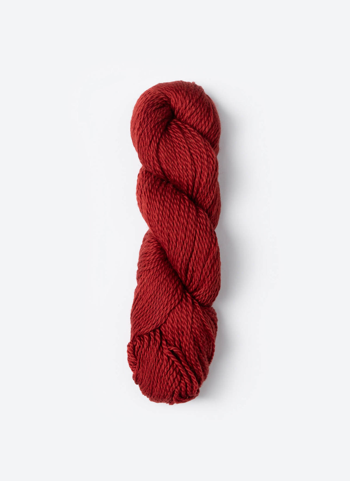 Red skein of yarn on a white background